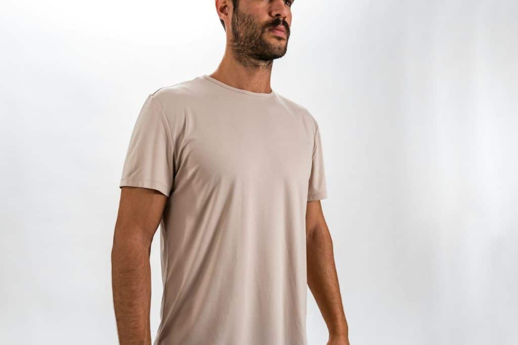 The man is wearing a neutral-colored shirt.