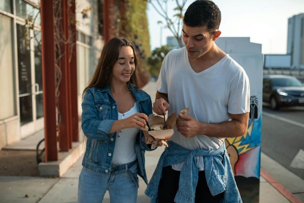 A man and woman eating