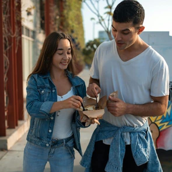 A man and woman eating