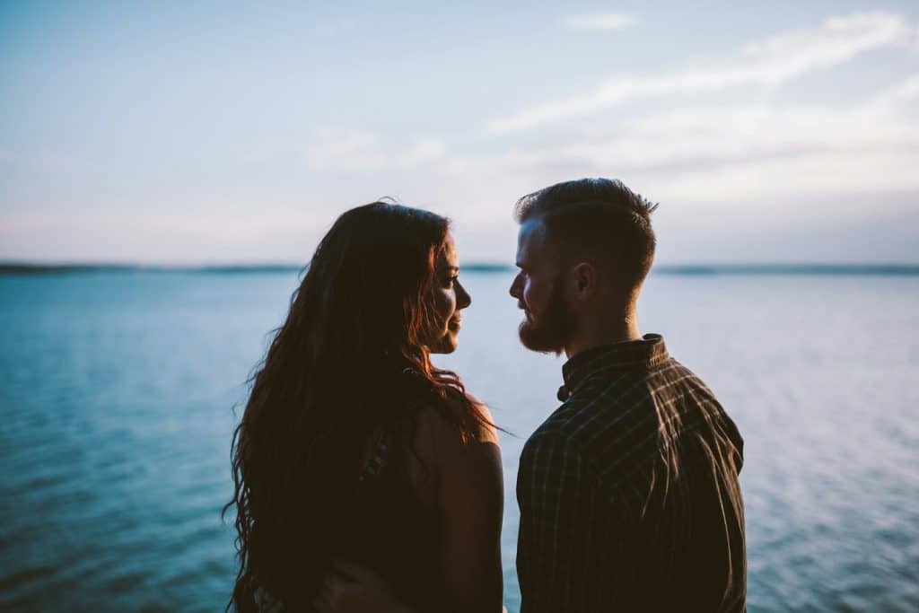 The couple is looking at each other.