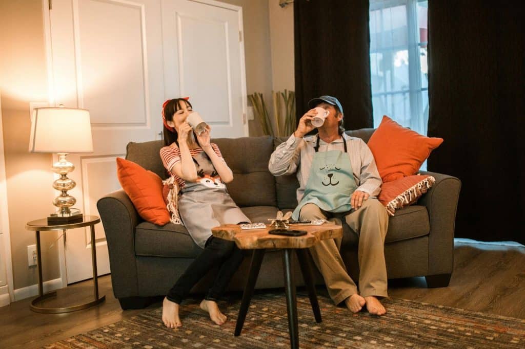 A man and woman drinking instead of talking