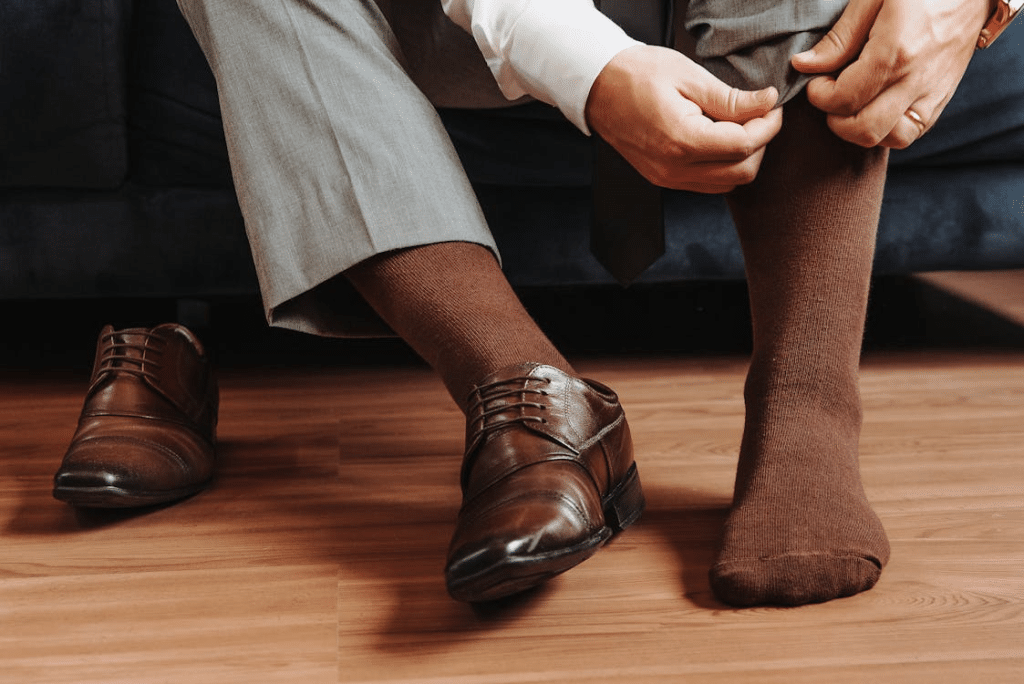 Elegant Man Wearing Socks to Expensive Shoes