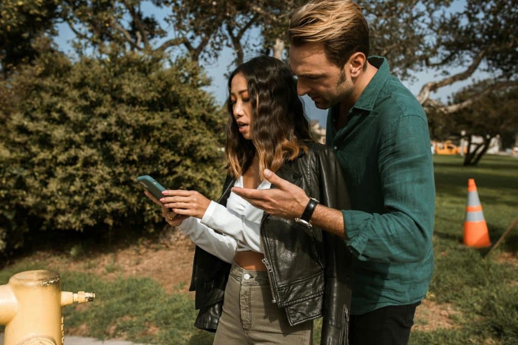A man checking woman’s phone