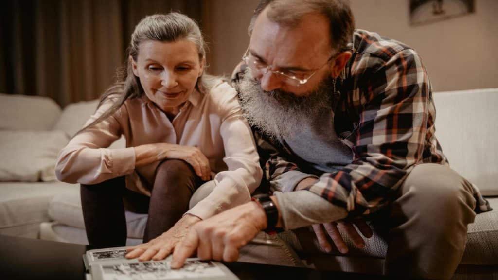 A couple looking at old photos