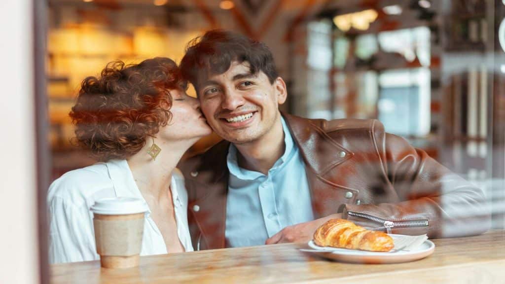 A woman kissing her husband’s cheek
