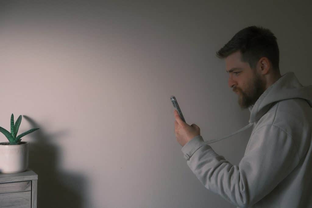 The man is holding his phone.