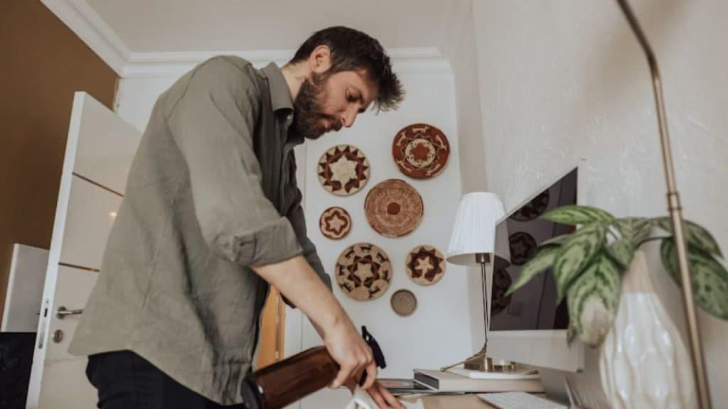 A man looking disappointed after doing a chore