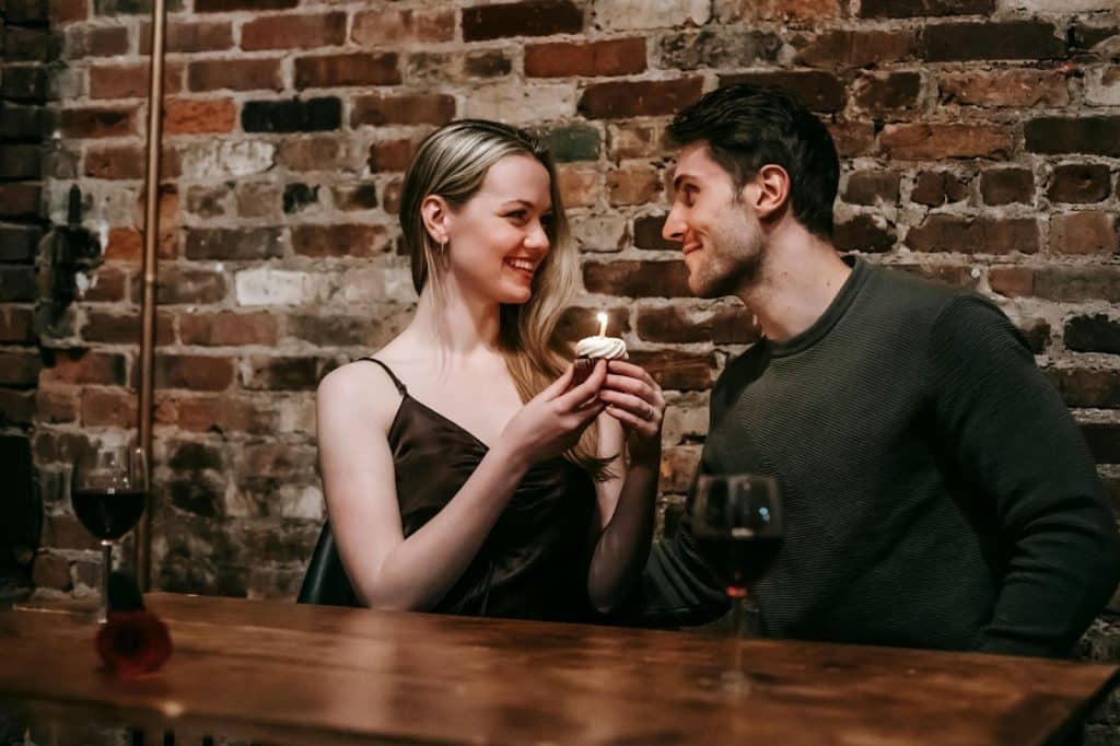 A man and woman facing each other