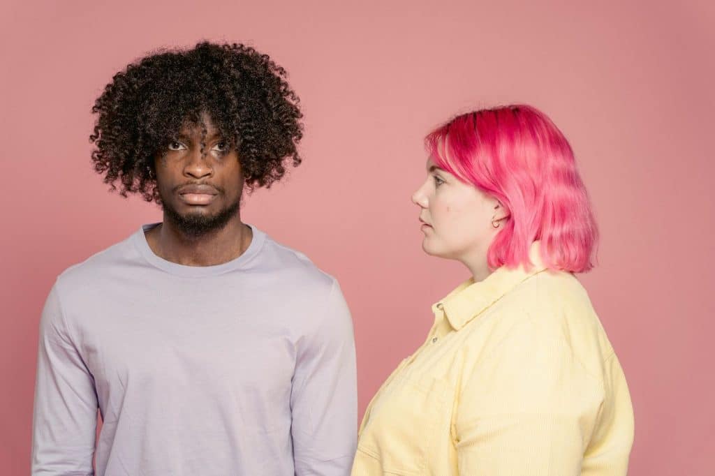 A woman looking at the man