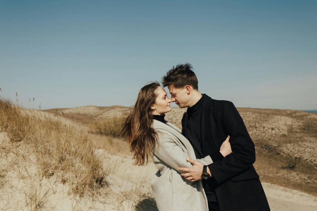A man and woman facing each other