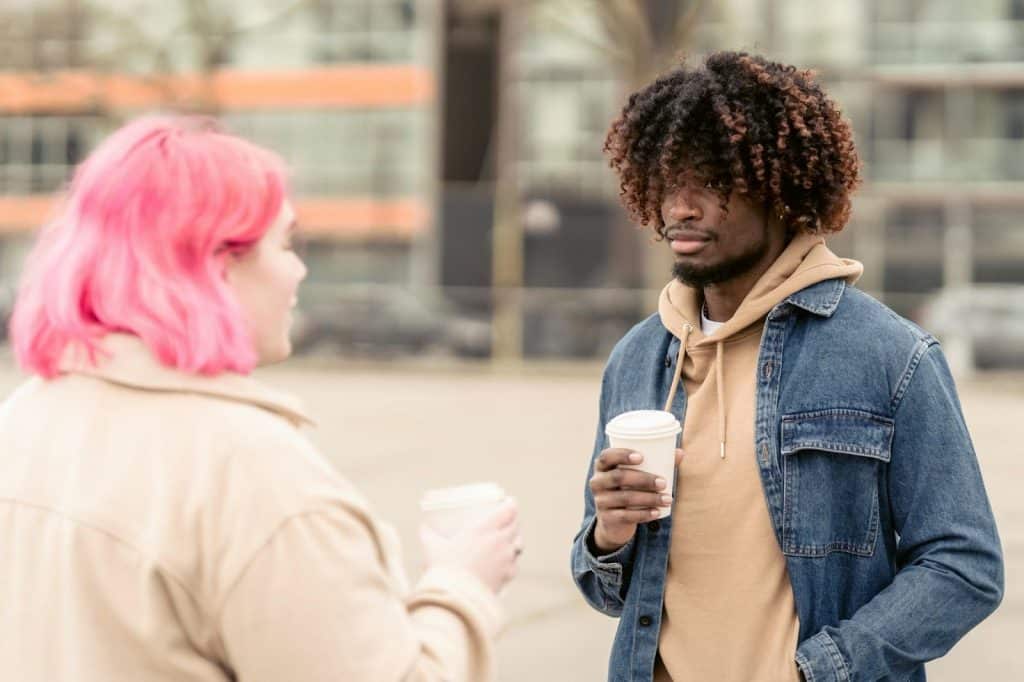 A man and woman having coffee