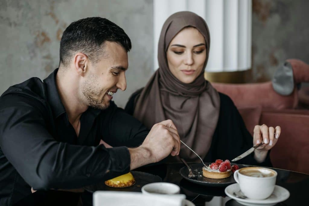 A man and woman eating