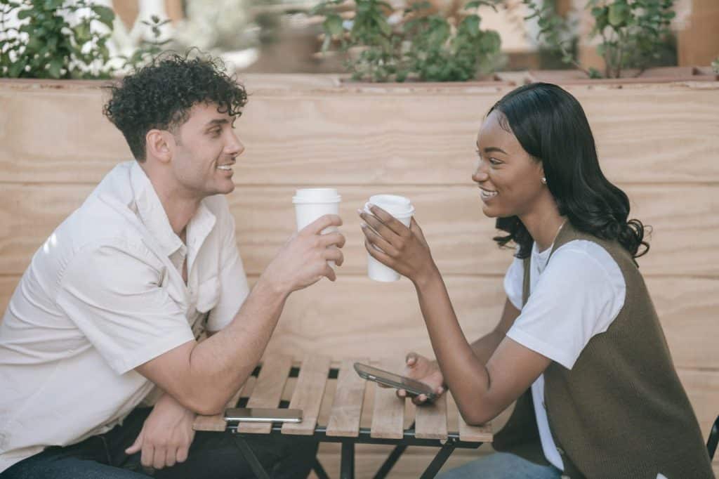 A man and woman smiling at each other