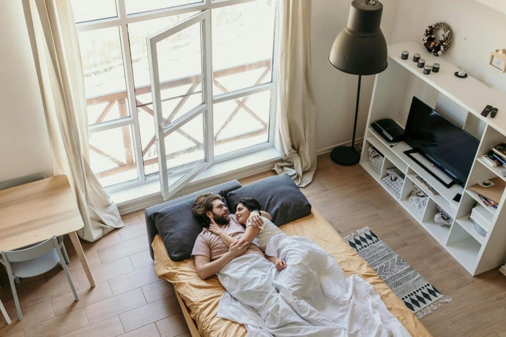 A man making a woman laugh