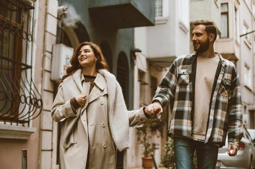 A man showing support to a woman by staying on her side