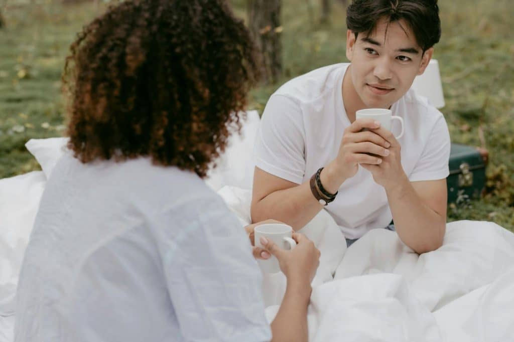 A man and woman having a picnic