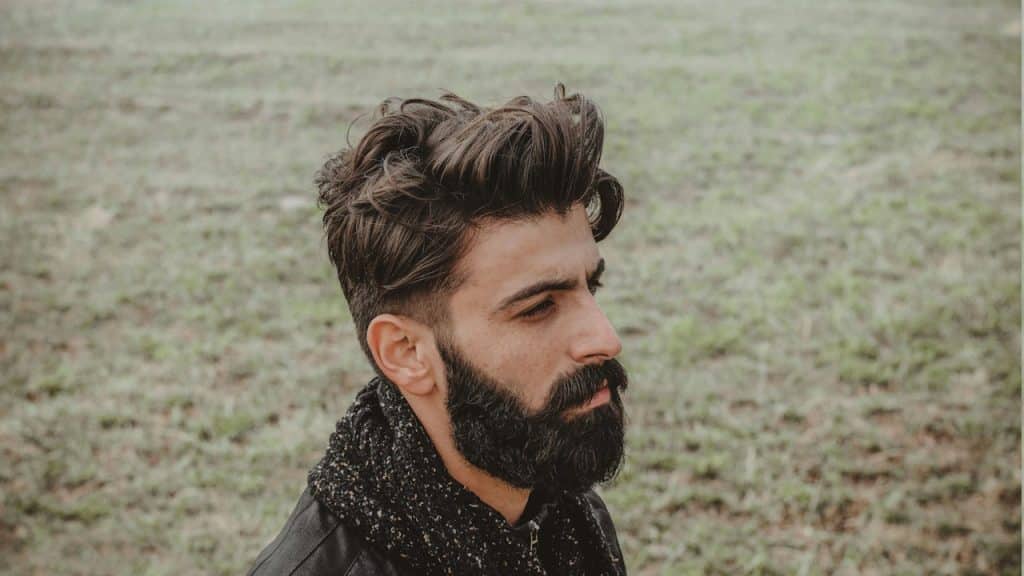 A pensive bearded man.