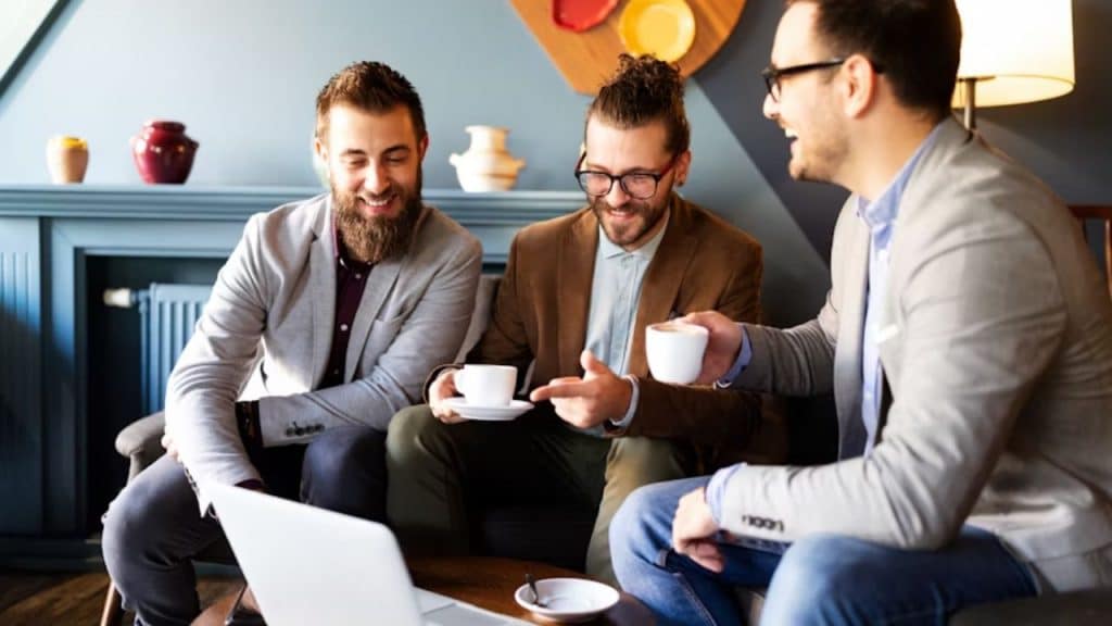 Man talking with friends at a café