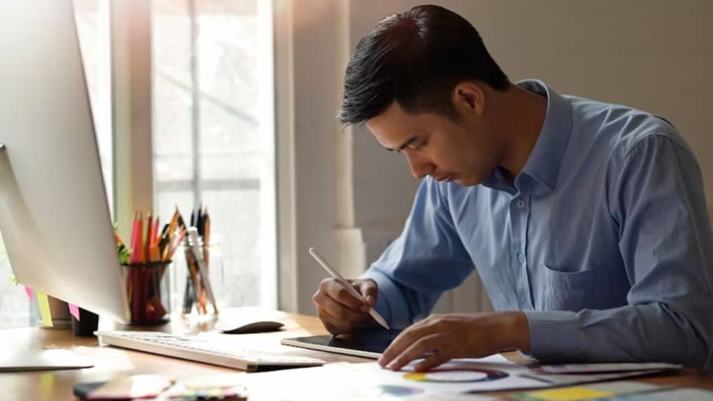 Man sitting calmly while journaling after work