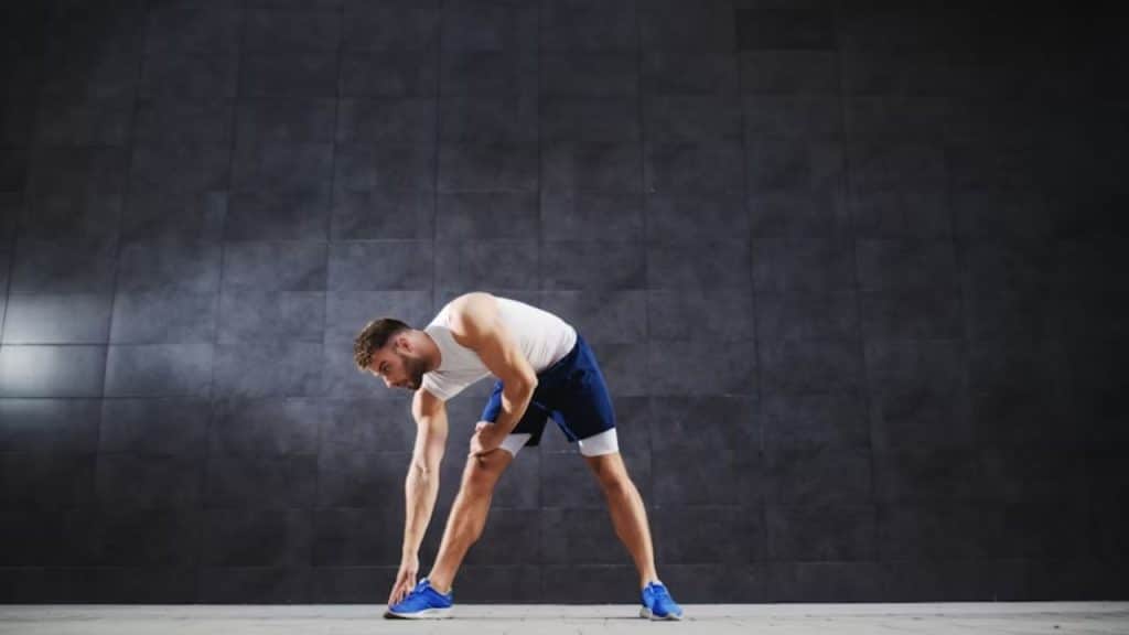 Man exercising at home early in the morning before work