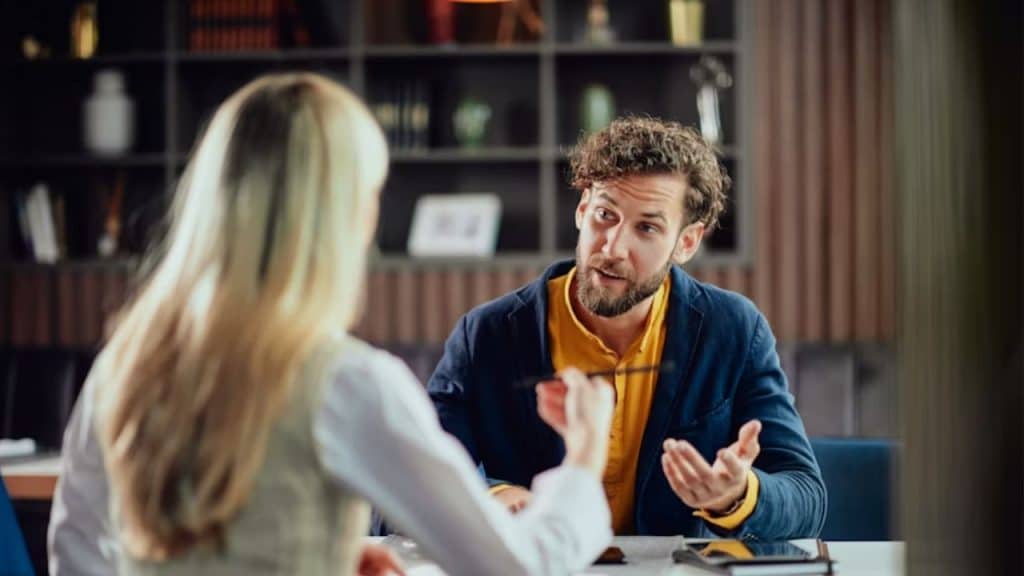 Couple having a serious but calm conversation at home