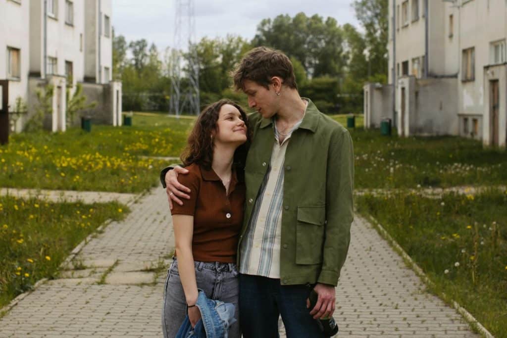 The woman and the man are looking at each other.