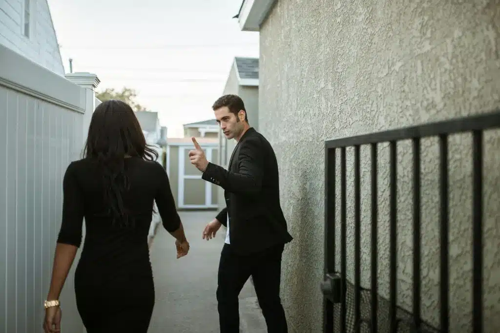 A man pointing a woman