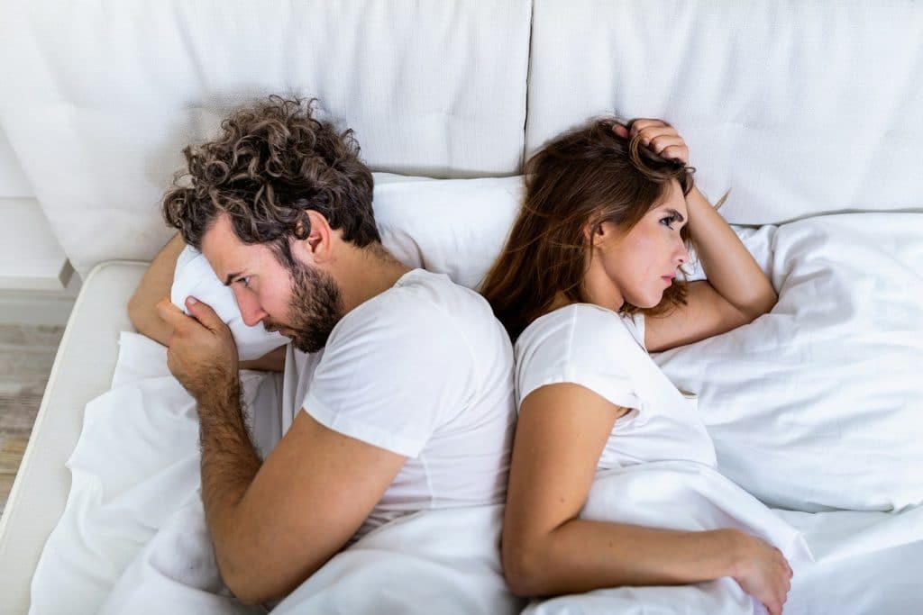 The couple is ignoring each other.