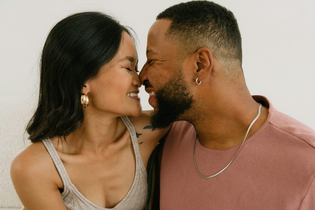 The couple is smiling at each other.