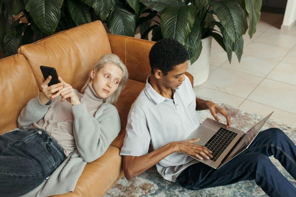 A woman checking on his partner’s activity