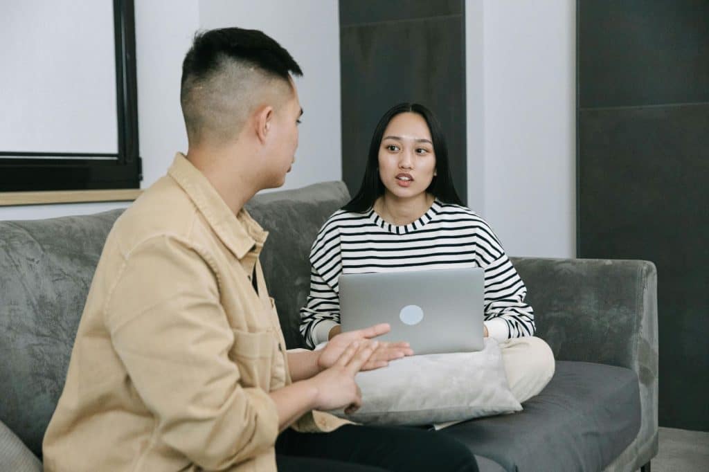 A man listening to a woman