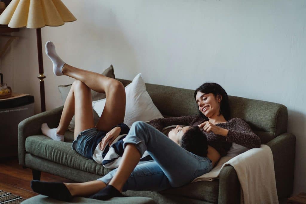 A man and woman chilling at the couch