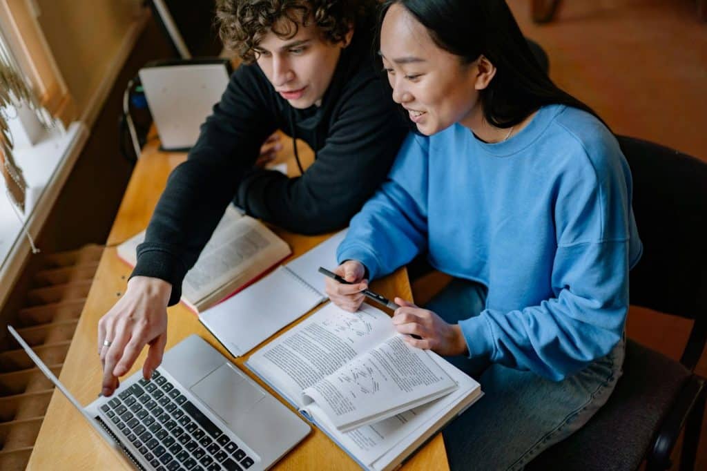 A man teaching something to a woman