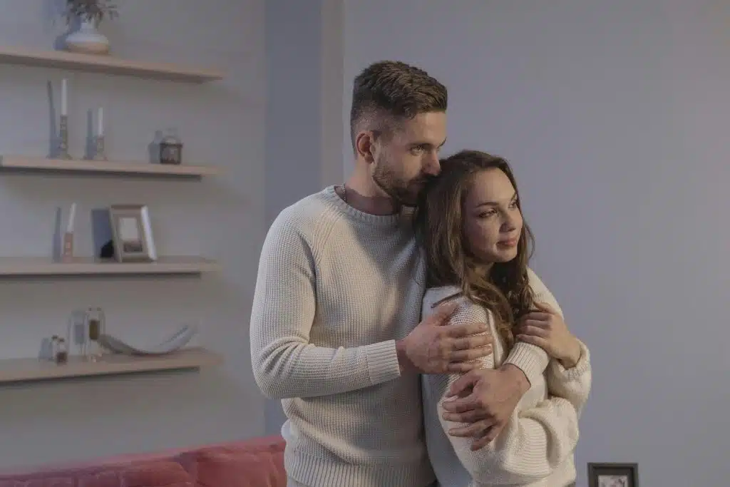 A man embracing a woman