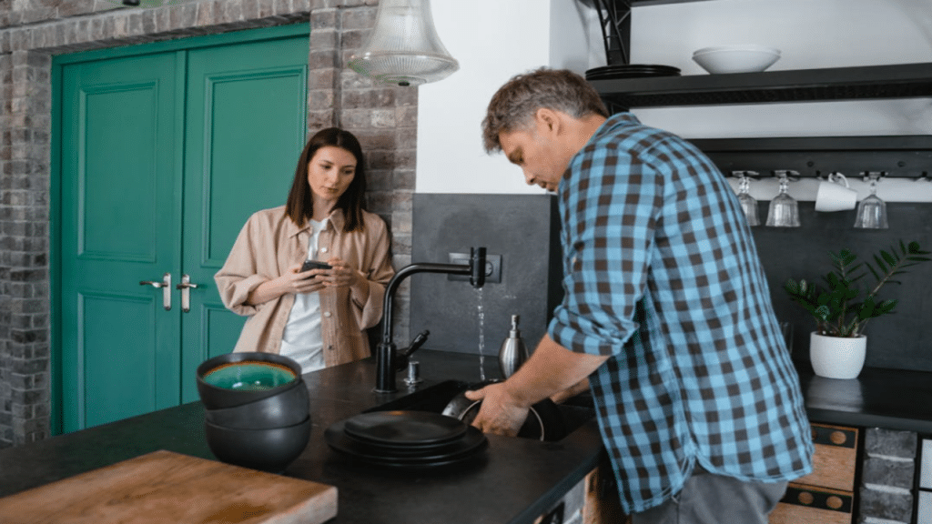 A couple talking in the kitchen