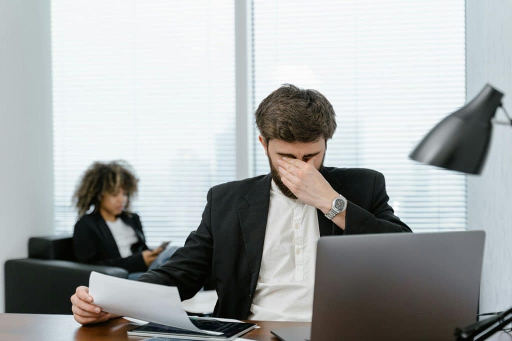 A man having eye strain