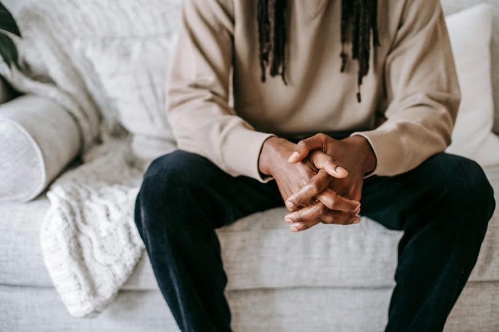 A man sitting at the couch