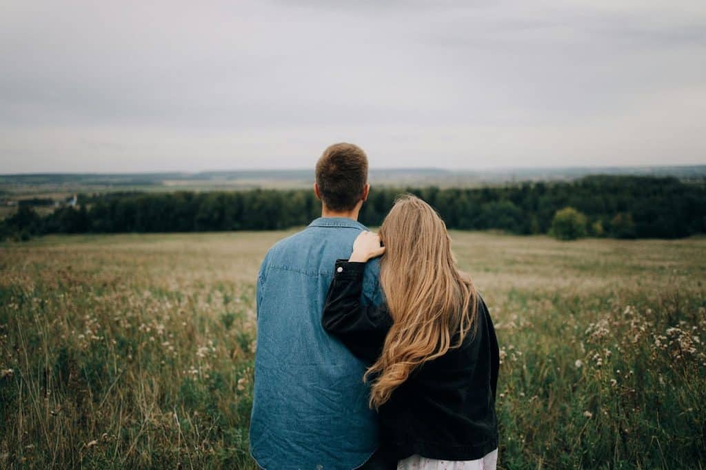 A man and woman looking at the view