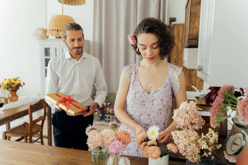 The man is about to give a gift to the woman.