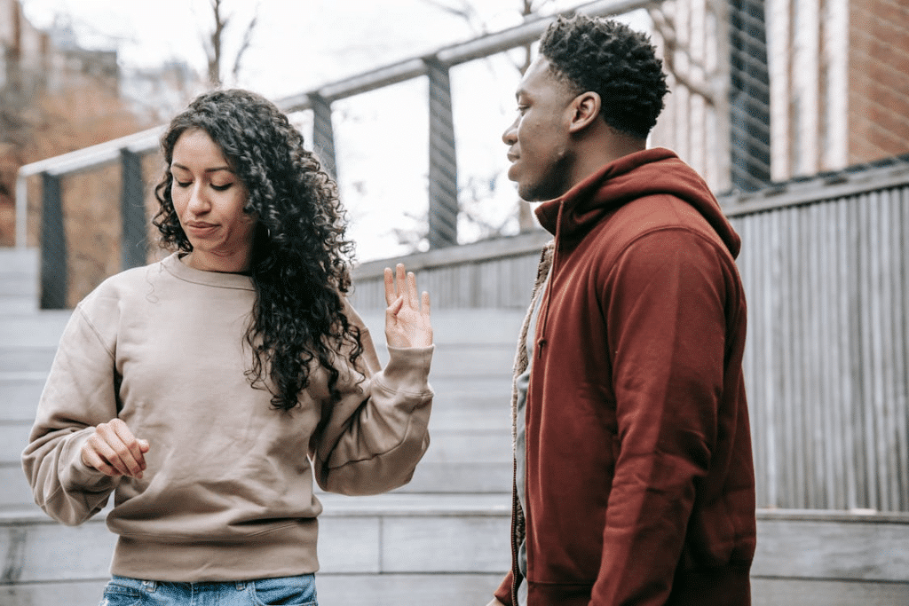 Multiethnic couple arguing on street