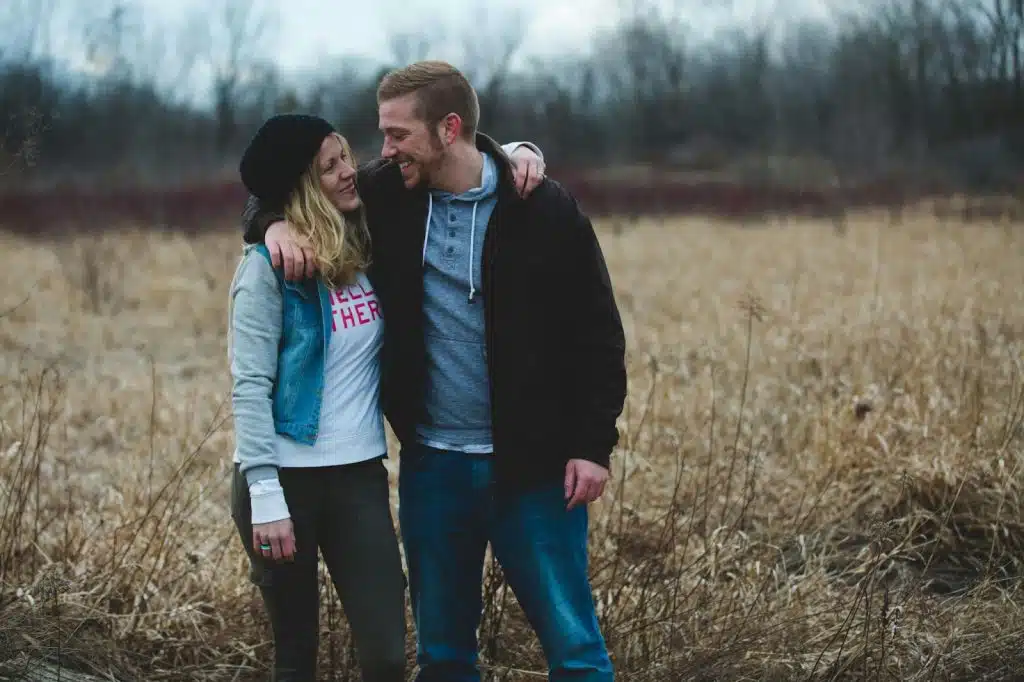 A man and woman smiling at each other