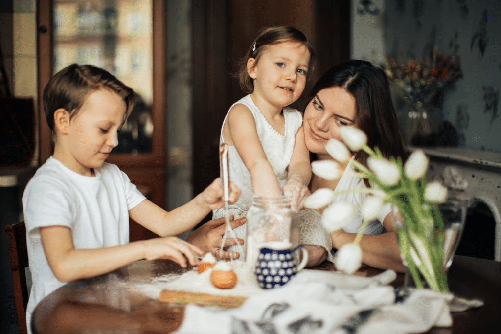 Photo of Woman Sitting With Children