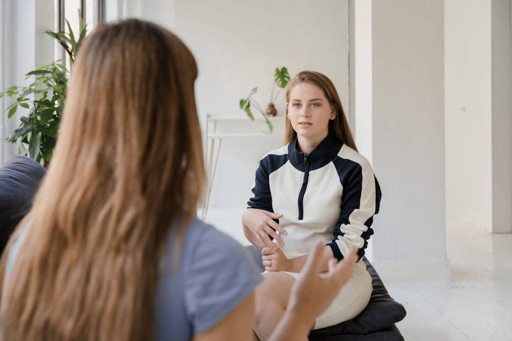 Two Women Talking in Living Room