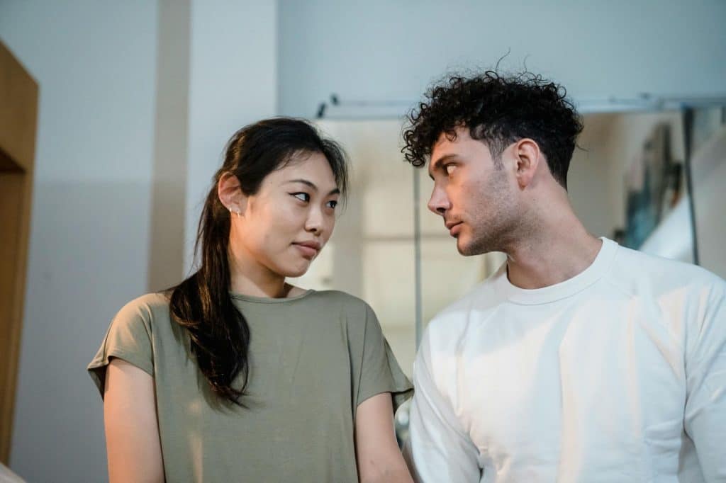 A man and woman looking at each other