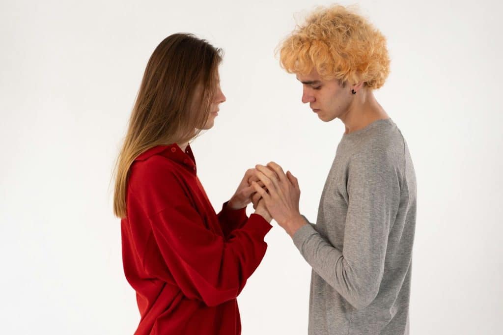 A man and woman holding hands
