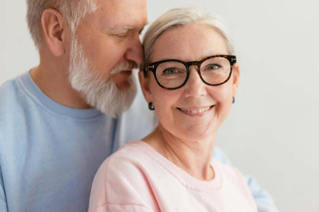 A man and woman smiling