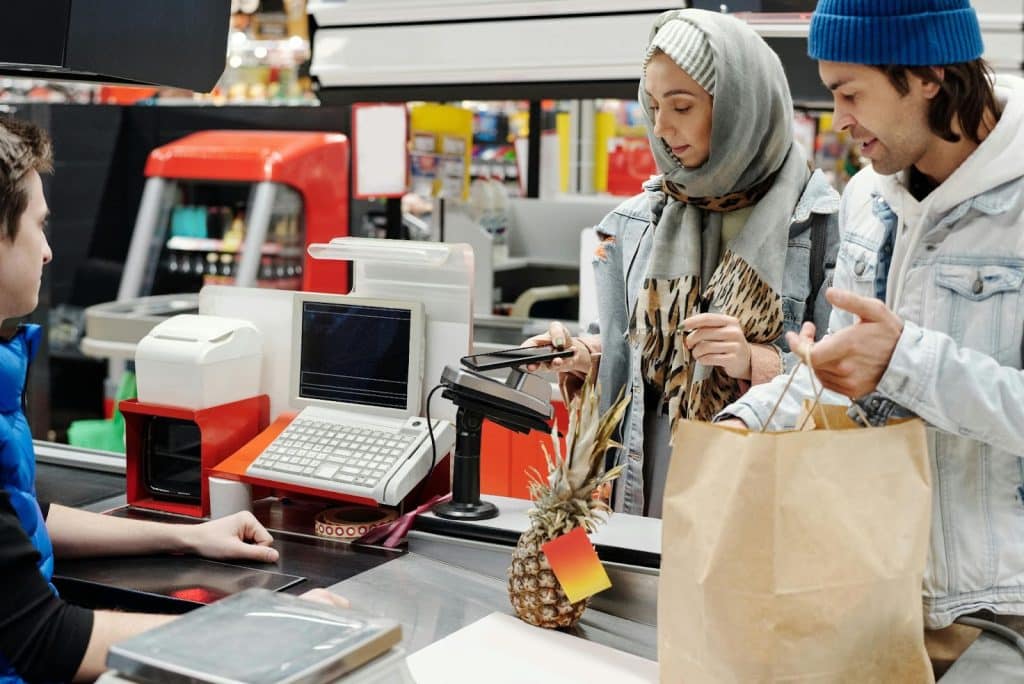 A man and woman grocery shopping