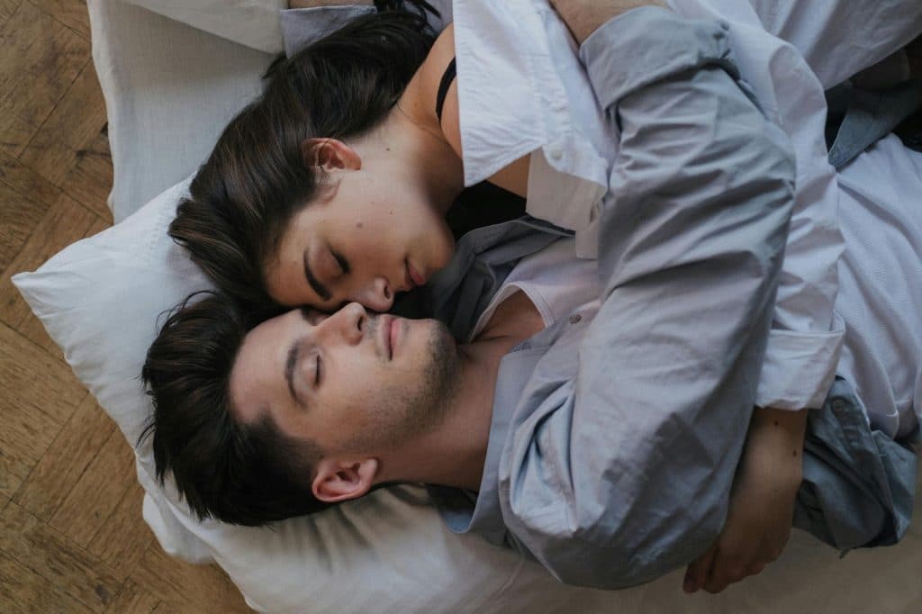 A man and woman hugging each other