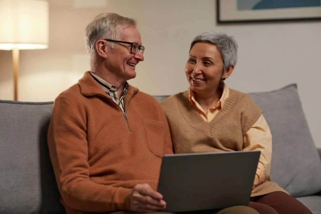 Old couple using a gadget