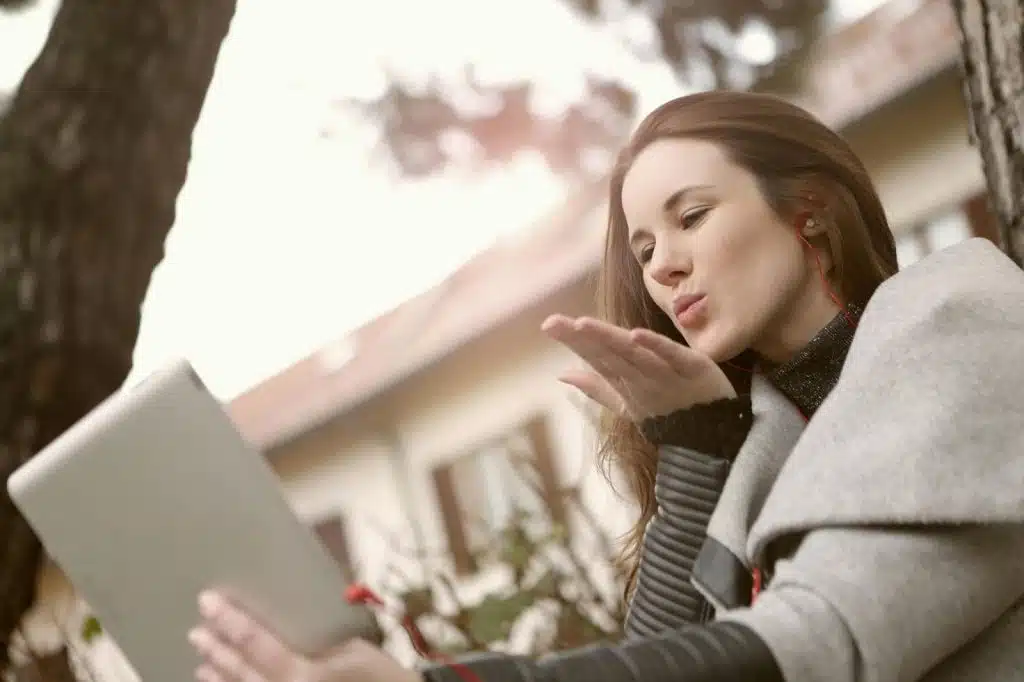A woman talking to someone online